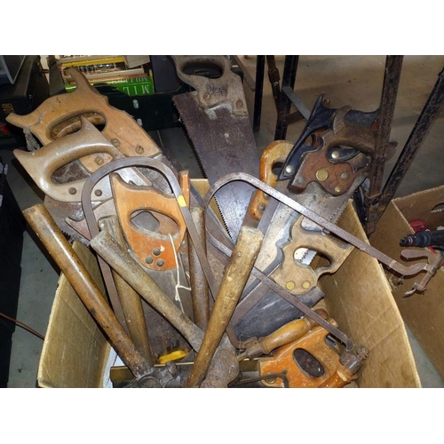 117 - A large box of various saws and hammers