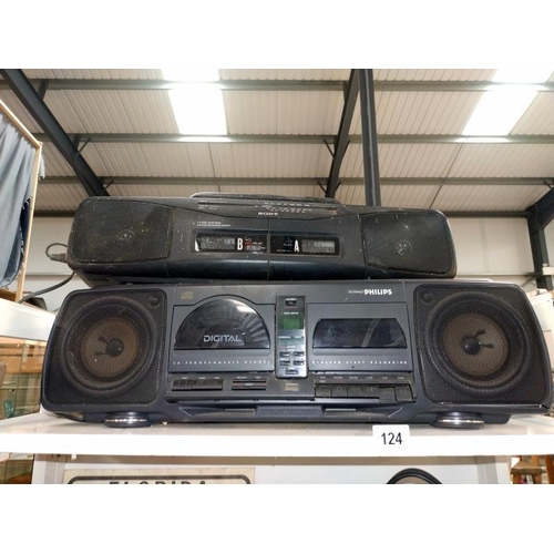 124 - A Sony twin cassette/ radio and a Philips CD/cassette/radio.