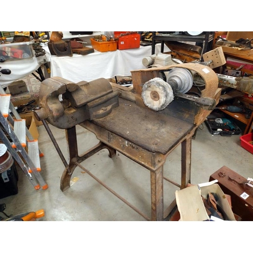 149 - A heavy metal legged vice/ polishing worktable