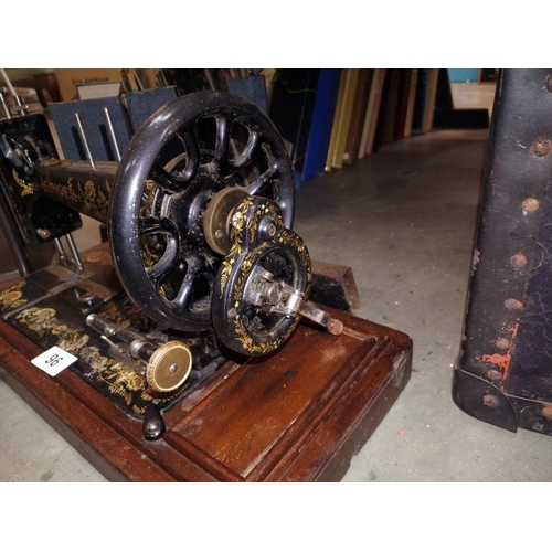 96 - A decorative cased Singer sewing machine