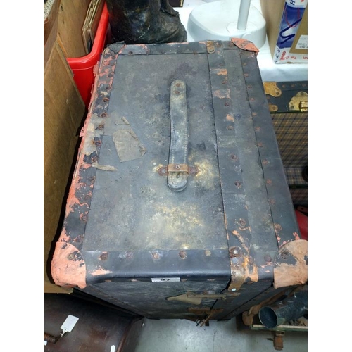 97 - A travel trunk. 41cm x 34cm x 91cm