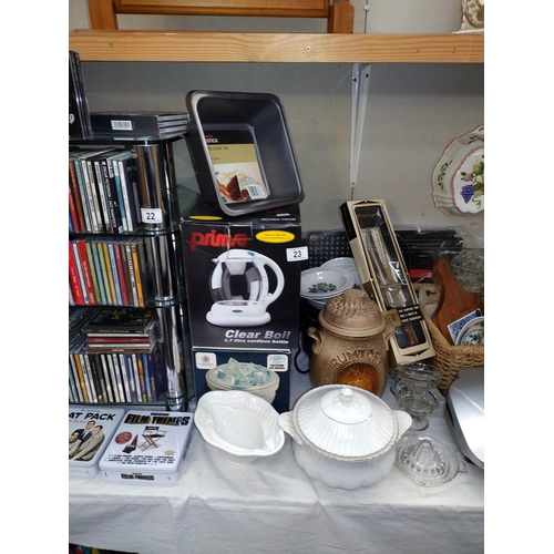 23 - A good selection of kitchenalia including new kettle, jelly moulds, enamel plates, etc