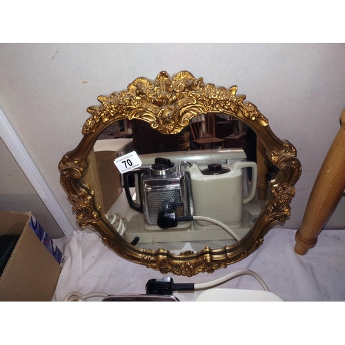 70 - A decorative gilt framed mirror