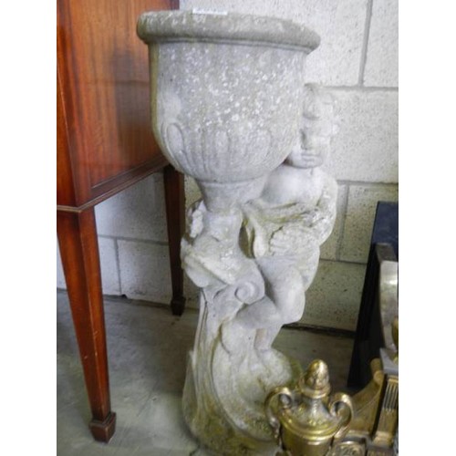 2946 - A tall garden planter on cherub base, 76cm tall, in good condition. COLLECT ONLY