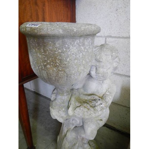 2946 - A tall garden planter on cherub base, 76cm tall, in good condition. COLLECT ONLY