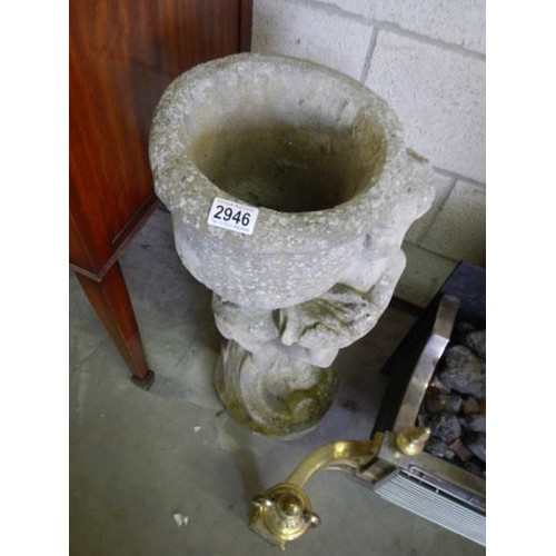 2946 - A tall garden planter on cherub base, 76cm tall, in good condition. COLLECT ONLY