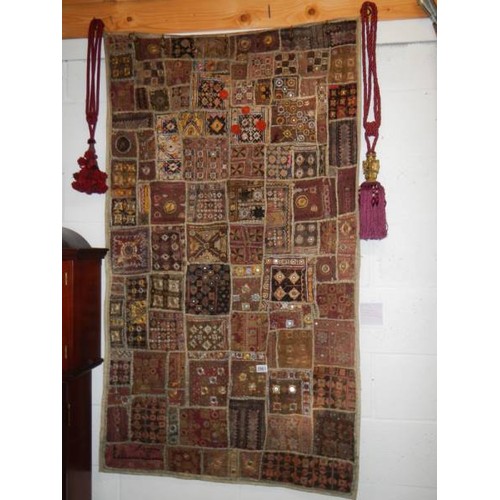 2961 - An early Rabari patchwork wall hanging with mirrored discs (91.5 x 163.5 cm)