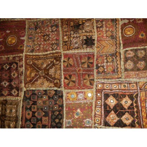 2961 - An early Rabari patchwork wall hanging with mirrored discs (91.5 x 163.5 cm)