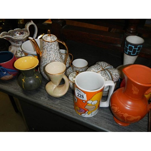 228 - A mixed lot of tea ware including teapot and four vases.