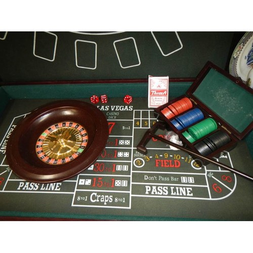 329 - A 'Gamble at Home' games set comprising Black Jack, Roulette etc.,