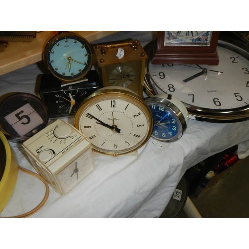 355 - A mixed lot including 6 clocks, 6 glasses, plate, toys etc.,