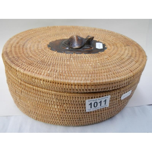 1011 - An unusual wicker oval box with carved wooden turtle on lid