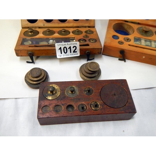 1012 - A selection of old brass boxed weights