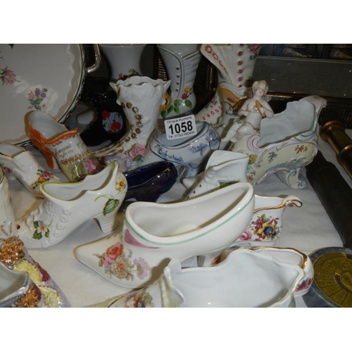 1058 - A good selection of collectors china shoes.
Collect Only.