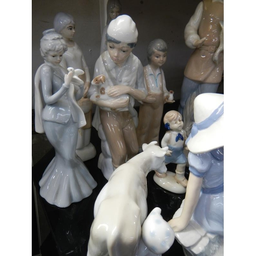 1063 - A selection of Lladro style figures etc.
Collect Only.