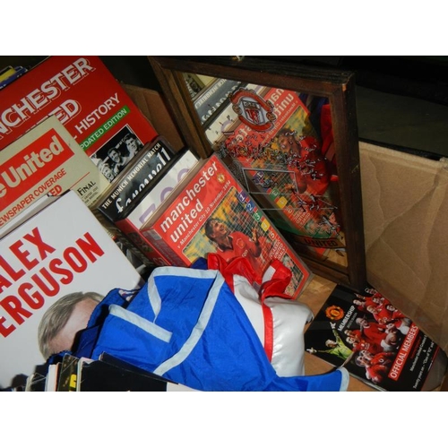 1152 - A selection of football memorabilia including books & videos etc.