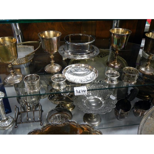 1210 - 4 shelves of silver plate items