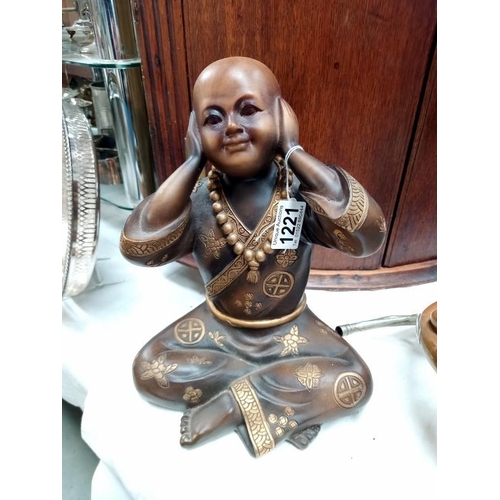 1221 - A resin Boy Buddha.