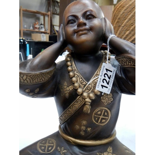 1221 - A resin Boy Buddha.