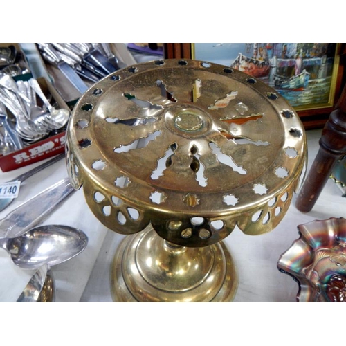 1138 - An early 20th century brass kettle on stand with cranberry glass handle