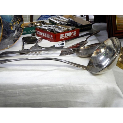 1140 - A collection of silver plate cutlery including ladle