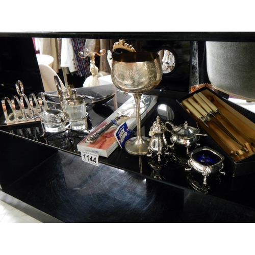 1144 - A selection of silver plate items