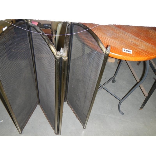 1198 - A round metal leg wooden top table & 4 fold fire screen. Collect Only.