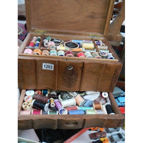 1203 - An early sewing box with drawer full of cottons etc.