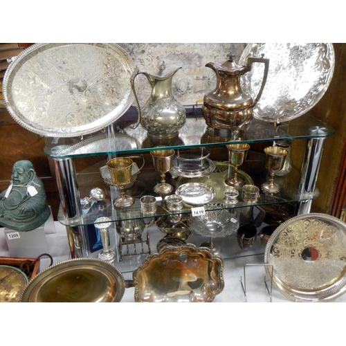 1210 - 4 shelves of silver plate items