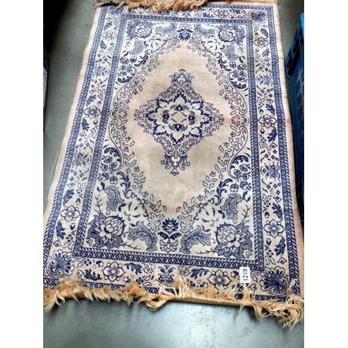 1219 - A pair of small rugs