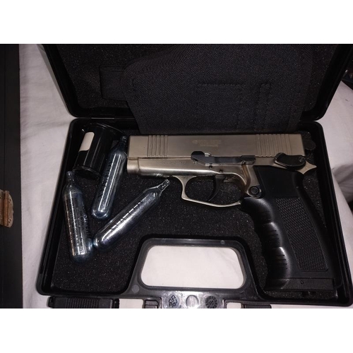 1230 - A cased BB pistol, complete