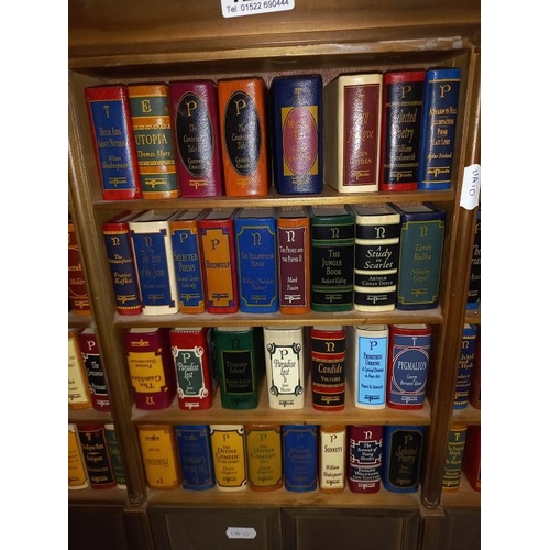 1232 - A small book case containing sets of miniature books