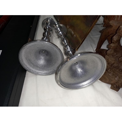 1234 - A pair of silvered candlesticks