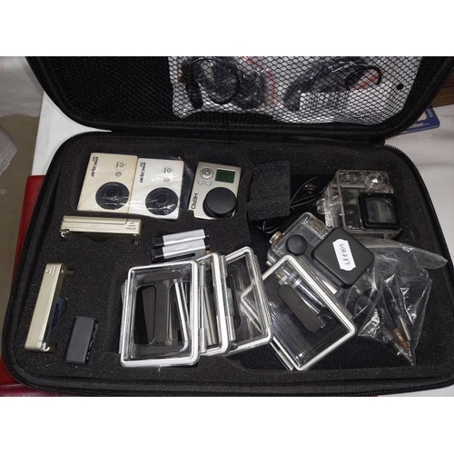 1236 - 3 cased Go Pro cameras