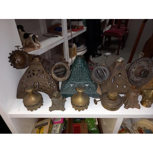 1302 - A large shelf of oil lamp parts