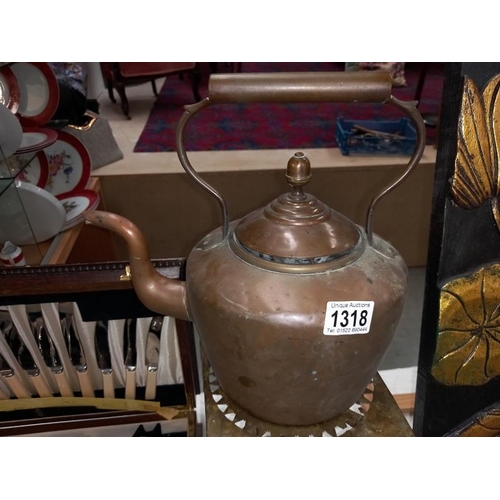 1318 - A Victorian copper kettle and trivet