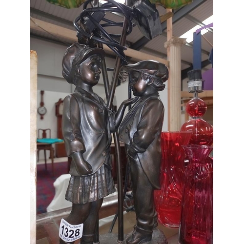 1328 - A table lamp with 2 children figures.
Collect Only.