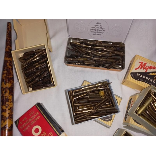 1335 - A collection of old pen nibs in collector boxes