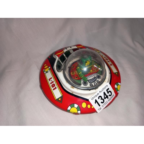 1345 - A tinplate wind up bump and go tin treasures, tin toy collectables UFO flying saucer. Diameter 13.5c... 