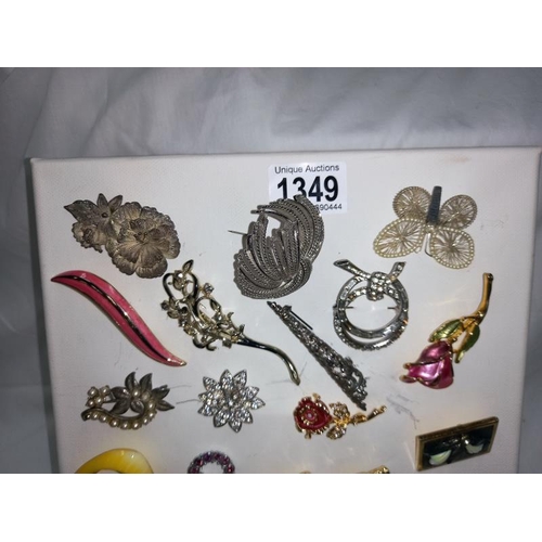 1349 - A pad of costume brooches. ( Pad not included)