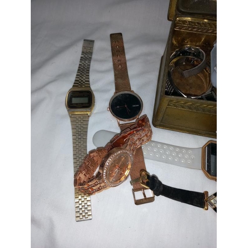 1352 - A tin of used wrist watches including Fitbit