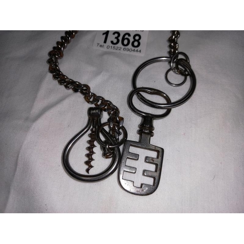 1368 - A Victorian metal chain with an antique metal key, & antique metal cast bottle opener