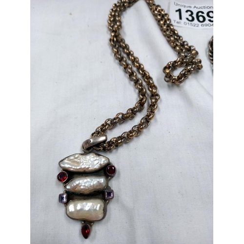 1369 - 2 good and unusual silver coloured necklaces, 1 of a Lion & 1 with mother of pearl, stamped 925.