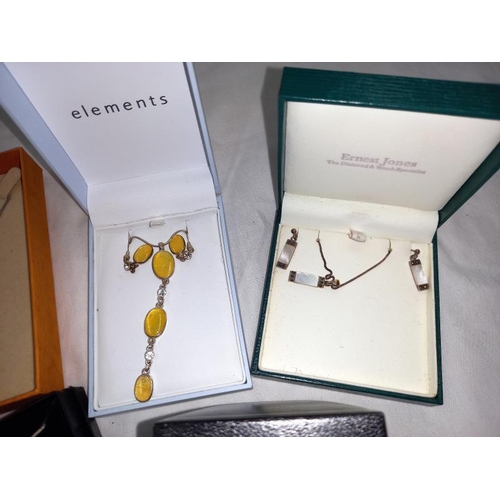 1410C - A quantity of ornate boxed earring and necklace sets