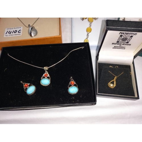 1410C - A quantity of ornate boxed earring and necklace sets