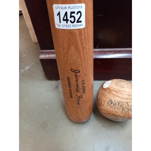 1452 - A vintage Louisville slugger & early Grady soft ball