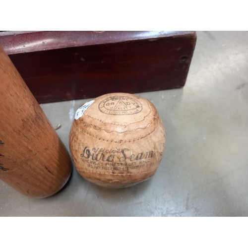 1452 - A vintage Louisville slugger & early Grady soft ball