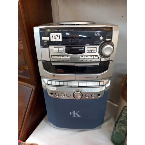 1471 - A compact disc karaoke system with 2 microphones, instructions, wires & some karaoke CD's (system mo... 