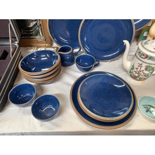 117 - A quantity of blue plates, milk jug, sugar bowl etc.