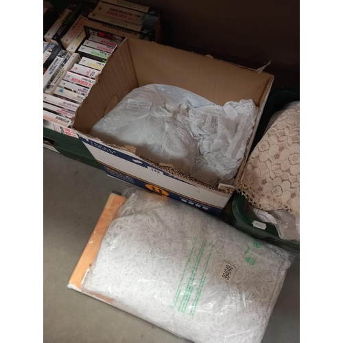 144 - A quantity of lace curtains etc (3 boxes)